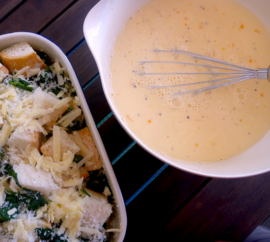 Unbaked cheese and spinach strata